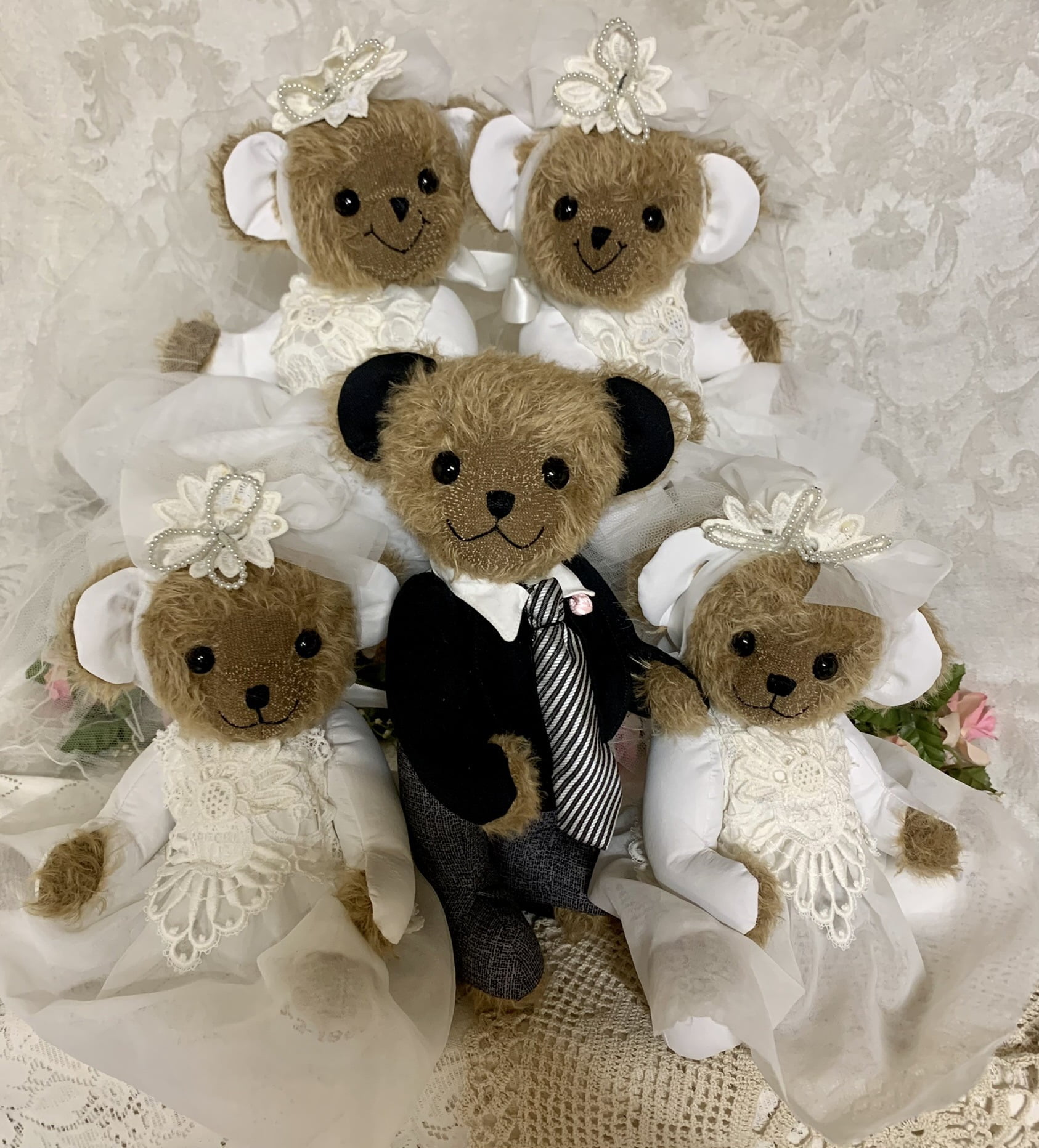 Five bears made from wedding dress with fur. 