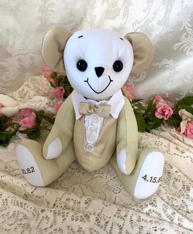 Grrom bear made from wedding dress with buttons and bow tie.