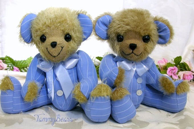 Two plush bears made from blue clothing.