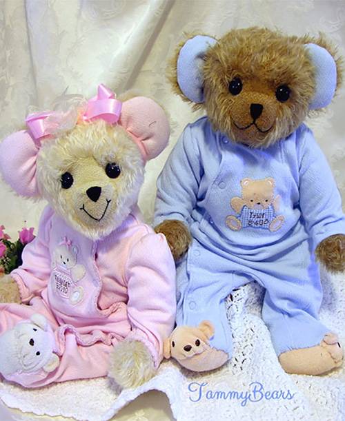 Two pink and blue memory bears made from baby clothing.