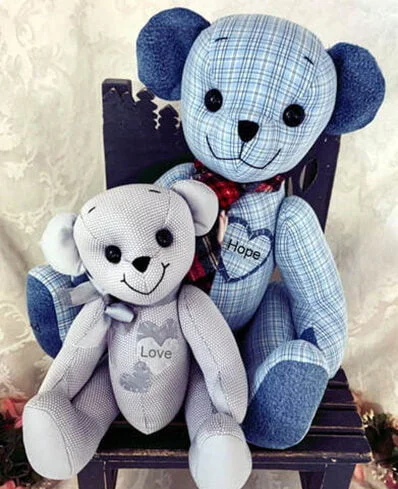 Memory teddy bears made out of plaid and gray shirts.