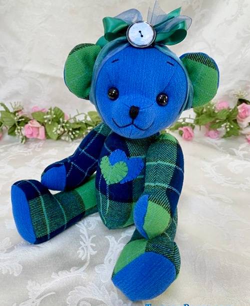 Blue with green memory teddy bear made from loved one's shirts.