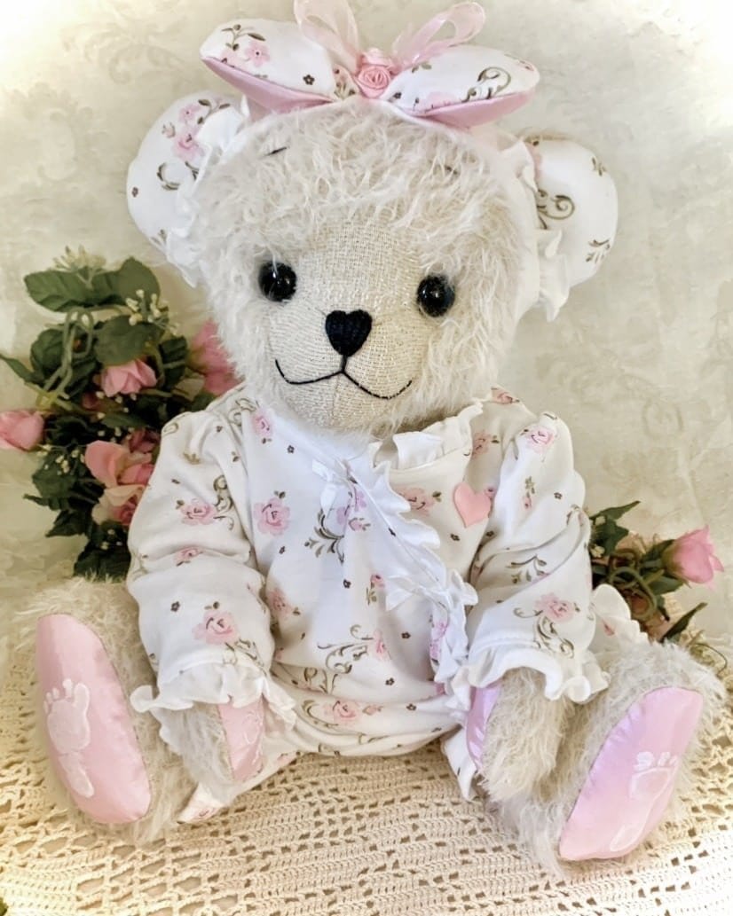 Memory Bear made from baby clothing white and pink sleeper. 