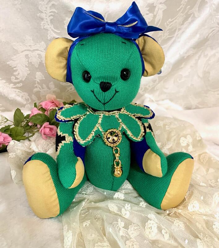 Bear made from green sweater with gold.