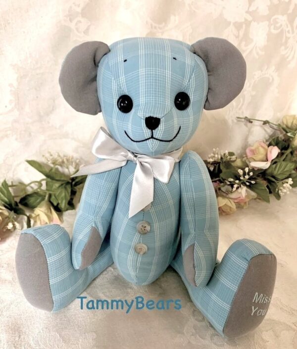 Memorial teddy bear crafted from a light blue shirt.