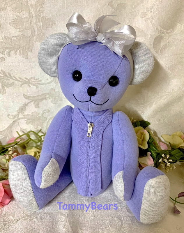 Memory bear madef from purple sweatshirt with zipper infront.
