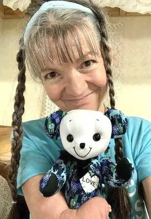 Tammy holding a memory bear.