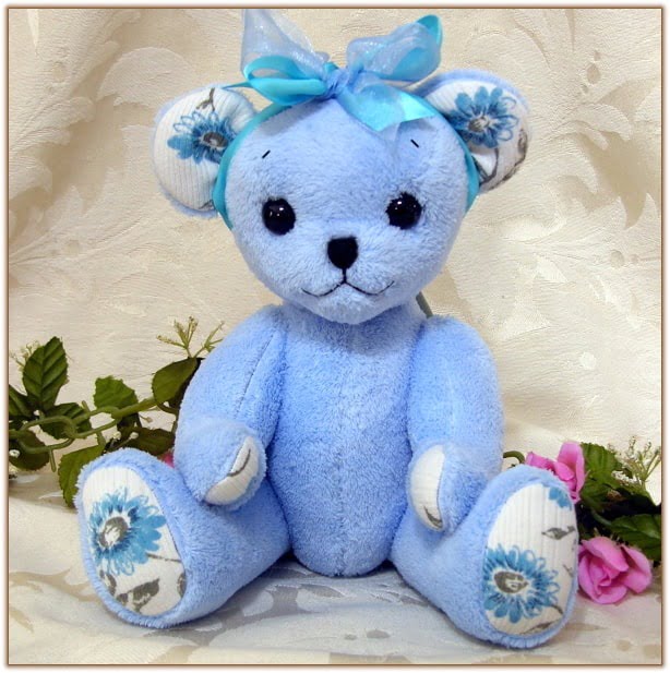 Comforting memorial teddy bear made from blue fleece robe.