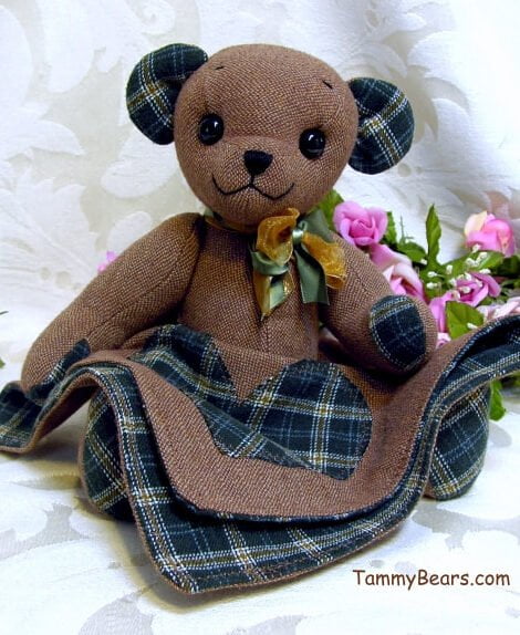 Brown bear with blanket made from memory clothing.