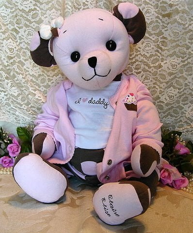 Pink and brown baby bear made from baby clothing.