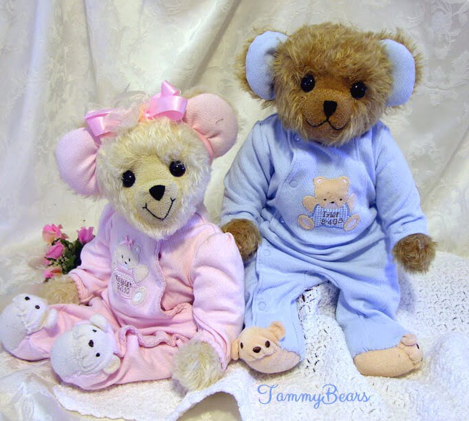 Two baby bears made from pink and blue sleepers.