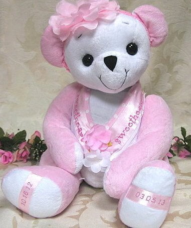 Happy baby bear made with pink and white plush.
