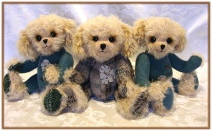 Three puppy bears made from dog bed.