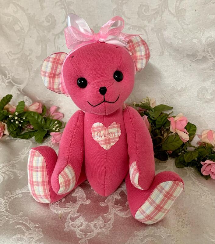 Memorial teddy bear made from pink shirts.