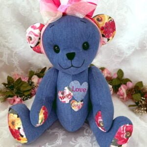 Memorial teddy bear made from pink and blue shirts.